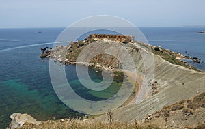 Malta nature, cliffs in malta, Ramla Bay in Malta, maltese landscape with the hill and different blue colour sea on sunny day, sce