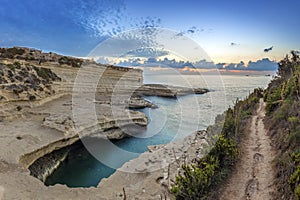 Malta - Panoramic view of the sunrise at St.Peter`s pool