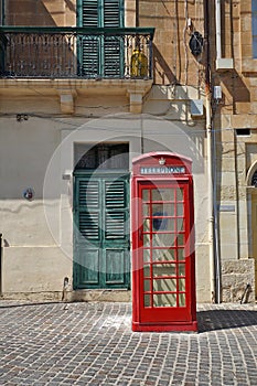 Malta: red vintage British telephone booth on Malta