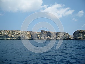 Malta sea scenery of steep coast made of limestone with plenty of caves