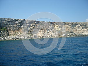 Malta shore steep coastal line with visible geomorphological layers of limestone