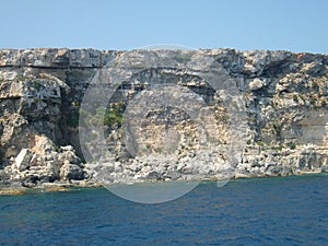 Malta shore steep limestone rocky slopes with different geomorphological layers