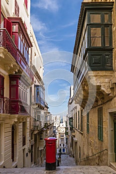 Malta, Typical narrow streets with colorful balconies in Valletta , Malta