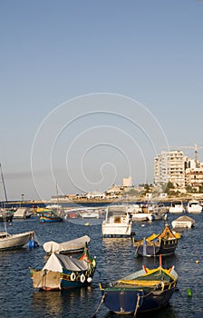Maltese luzzu boat in harbor st. julian's malta