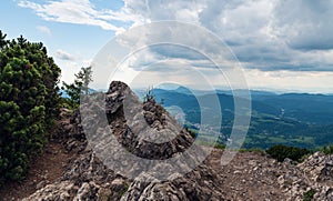 Maly Rozsutec hill summit in Mala Fatra mountains in Slovakia with Terchova village and hills on the background