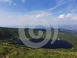 Maly Staw lake, Schronisko Samotnia and Strzecha Akademicka huts in Karkonosze mountains in Poland