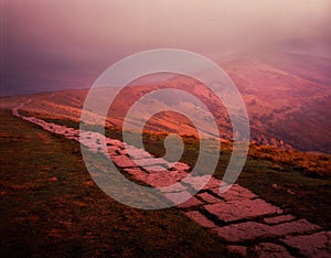 Mam Tor & The Great Ridge on a foggy sunrise in the Peak District National Park, UK