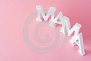 Mama word on pink background. Mother`s Day concept