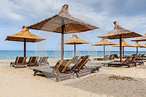 Mamaia, Black Sea, Romania. Straw umbrellas on the beach. photo