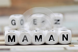 Maman, dice letters