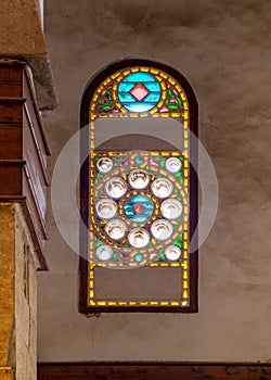 Mamluk era perforated stucco window with colorful stain glass with circular geometrical patterns, Beshtak Palace photo