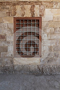 Mamluk era wooden closed window with wooden ornate grid over stone bricks wall, Blue Mosque, Cairo, Egypt photo