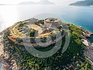 Mamula fortress among green bushes on a rocky island. Montenegro