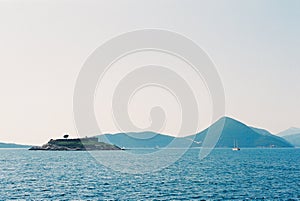 Mamula Island against the backdrop of the mountains in the Kotor Bay