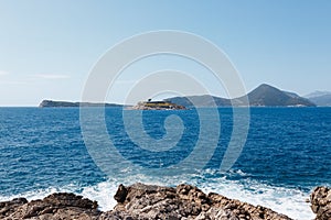 Mamula island in the Bay of Kotor with mountains in the background. Montenegro