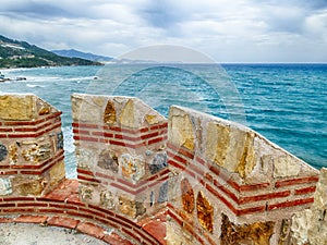 Mamure Castle, medieval castle crenellations,embrasures,parapet and merlons photo