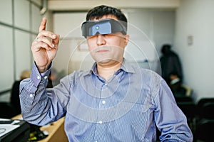 Man in 3d computer glasses touching the air
