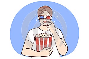 Man in 3D glasses eating popcorn