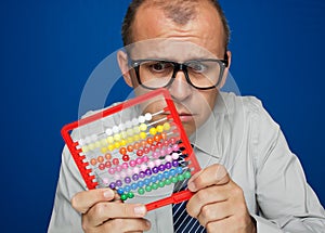 Man with abacus calculator