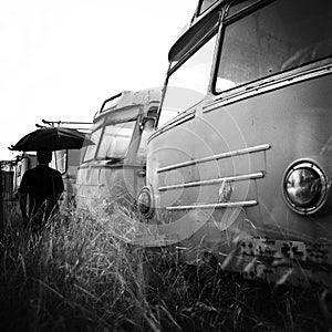 Man between abandoned buses