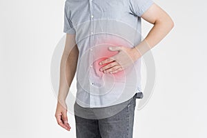 Man with abdominal pain, stomach ache on gray background