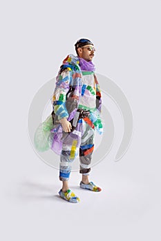Man addicted of sales and clothes, wearing plastic, recycling concept