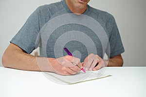 Man adding signature to document