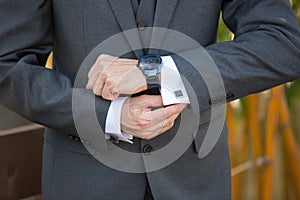 Man adjusting his cufflinks