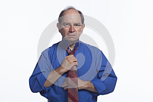 Man adjusting his tie, horizontal