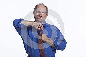 Man adjusting his tie, horizontal