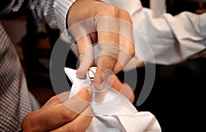 Man adjusting sleeve cuff