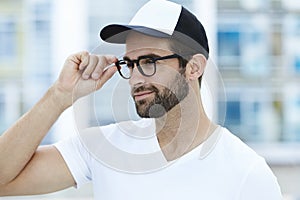 Man adjusting spectacles