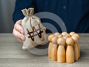 Man adjusts and south korean won money bag to a crowd of people.