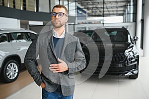 Man adult customer male buyer client wears classic suit white shirt chooses auto wants to buy new automobile touch check