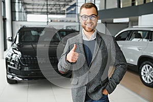 Man adult customer male buyer client wears classic suit white shirt chooses auto wants to buy new automobile touch check