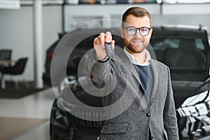 Man adult customer male buyer client wears classic suit white shirt chooses auto wants to buy new automobile touch check