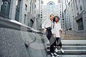 Man with afrian american woman together in the city outdoors