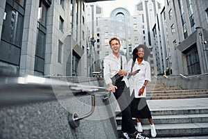 Man with afrian american woman together in the city outdoors