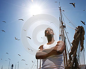 Man against boat's mast