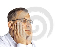 A man of age sits dreaming. On a white background