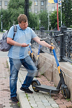 A man aged 40-44 rents an electric scooter work