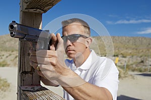 Man Aiming Machine Gun At Firing Range