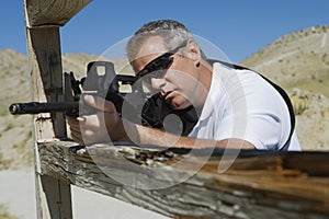 Man Aiming Machine Gun At Firing Range