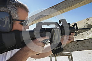 Man Aiming Machine Gun At Firing Range