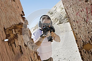 Man Aiming Machine Gun At Firing Range