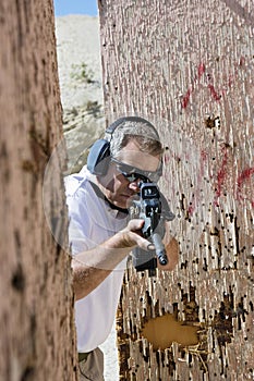 Man Aiming Machine Gun At Firing Range