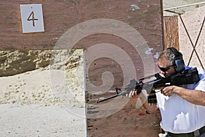 Man Aiming Machine Gun At Firing Range