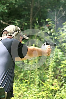 Man Aiming Pistol - Sideview