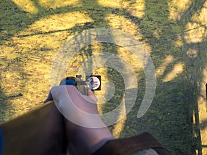 A man aims an air rifl