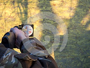 A man aims an air rifl